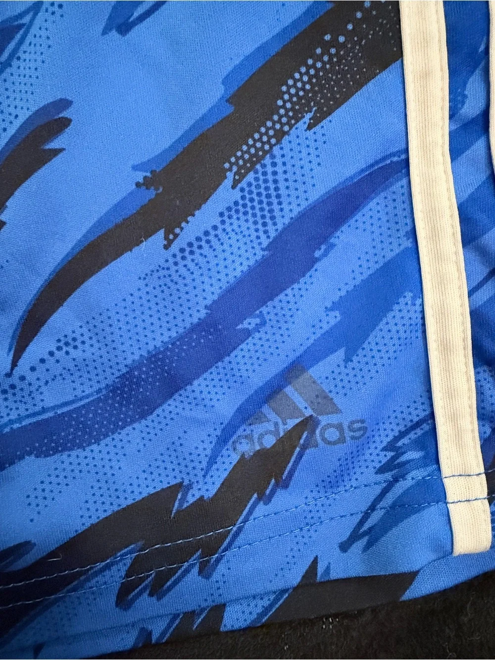 Adidas boys blue athletic shorts with black graphic & white stripes - size 6